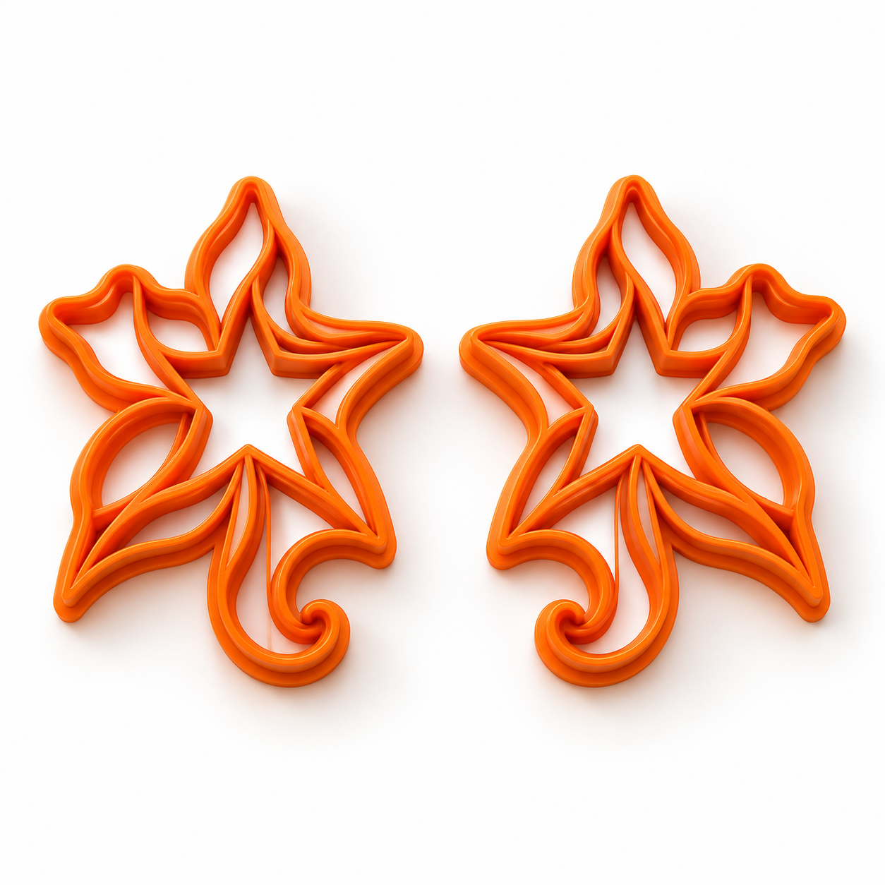 Étoile ondoyante — Collection Noël : deux emporte-pièces orange en miroir, gauche et droite
