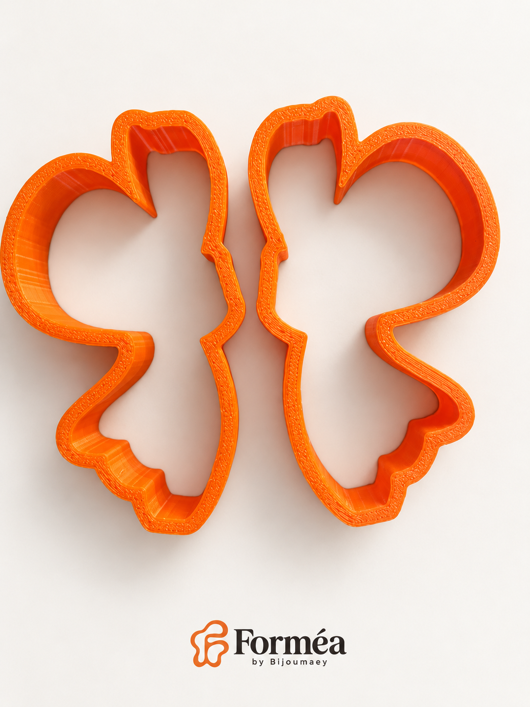 Deux emporte-pièces Aile de papillon orange disposés en miroir — Forméa