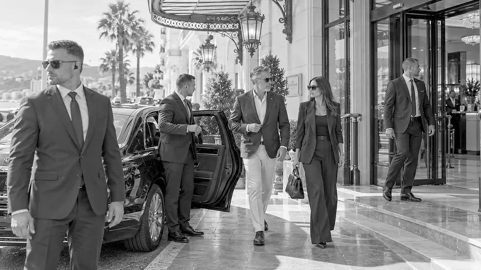 Full protection detail at a luxury hotel entrance: team leader, protection officer, security driver and advance agent