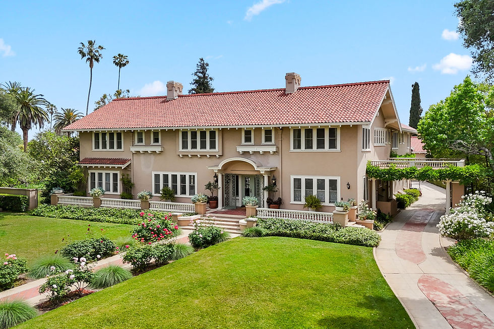 Large traditional home on Hillcrest Avenue, Pasadena, with a red tile roof above a sweeping lawn and curved path