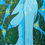 Thumbnail: Fantasy female painting of a blue alien woman surrounded by cosmic leaves and stars