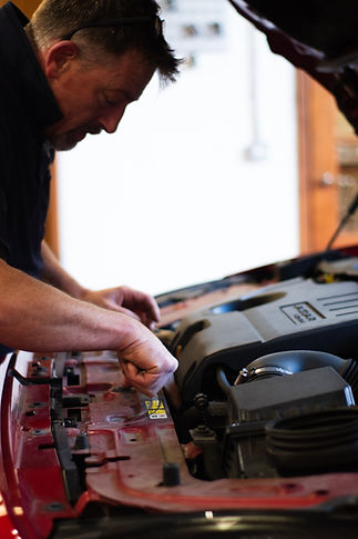 Experienced and trusted technicians performing car repair and servicing. 