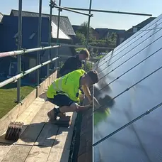 panels being fitted to roof 
