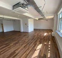large room with wooden floor