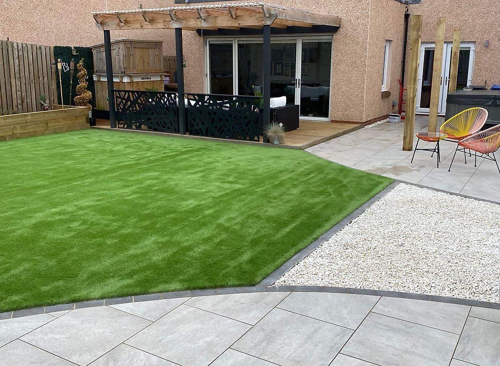 artificial lawn with gravel and paving patio