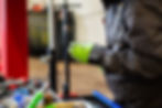 A technician providing van repair and service for a car.