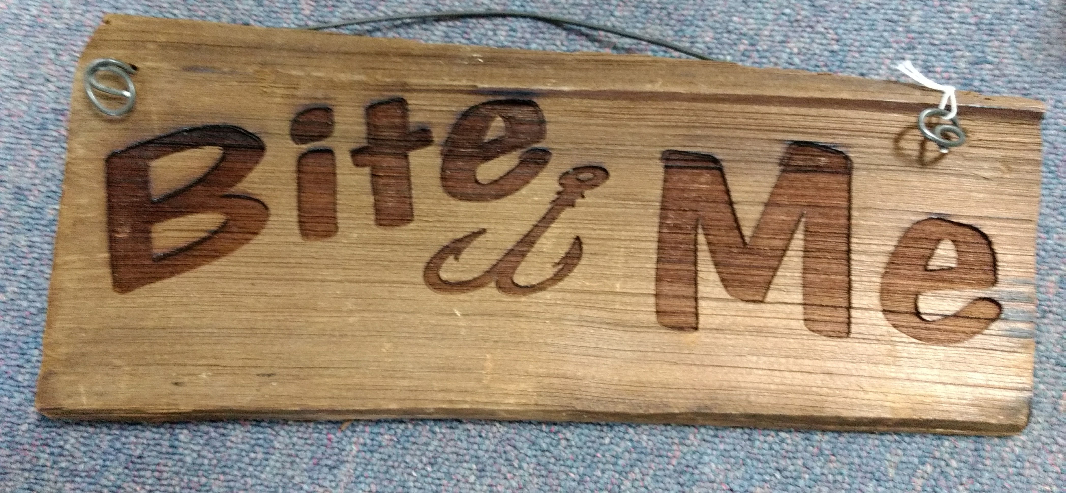 wood sign. bite me