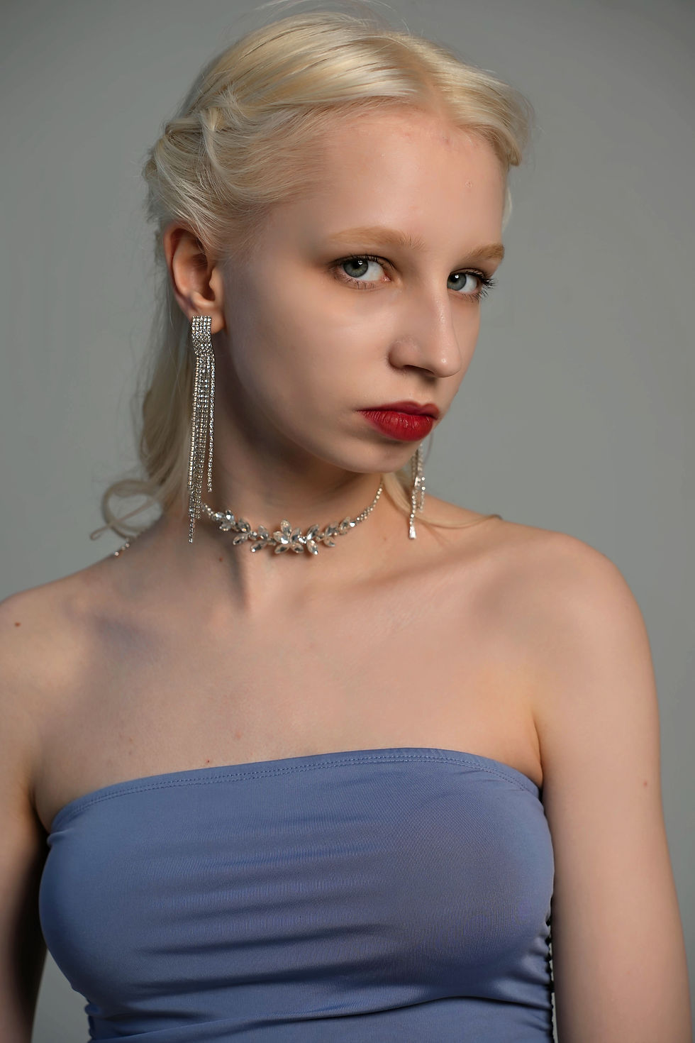 Model Lissa Neerell wearing a bright blue dress, photographed by Andrey I go  in the photo series “Bright Beth in Blue Dress.”