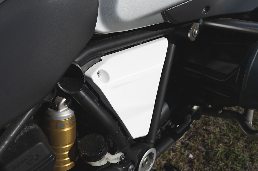 3D printed white frame cover panel fitted to BMW R1200GS chassis — precision fabricated by 3D Print Lab Florida