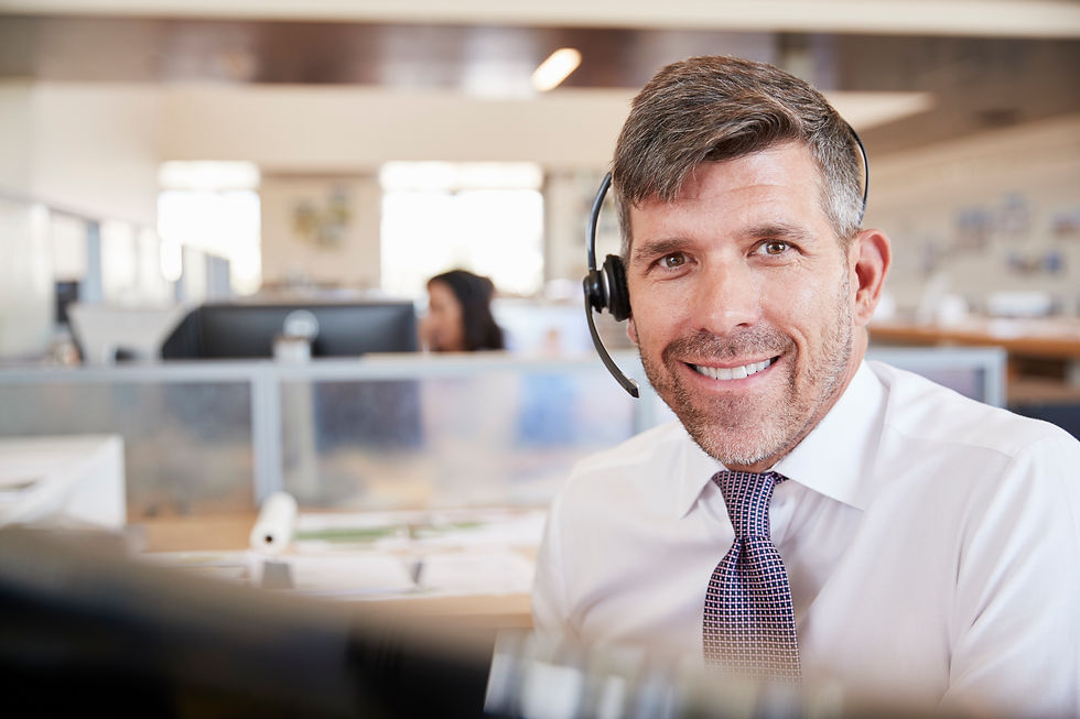 white-male-call-centre-worker-smiling-to-camera-2024-10-19-08-00-54-utc.jpg