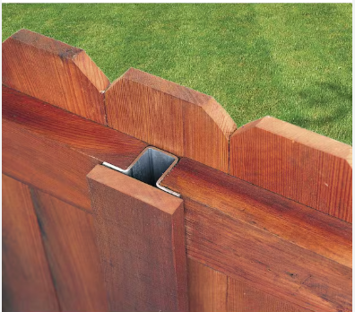 Eye-level view of steel fence posts installed in a row