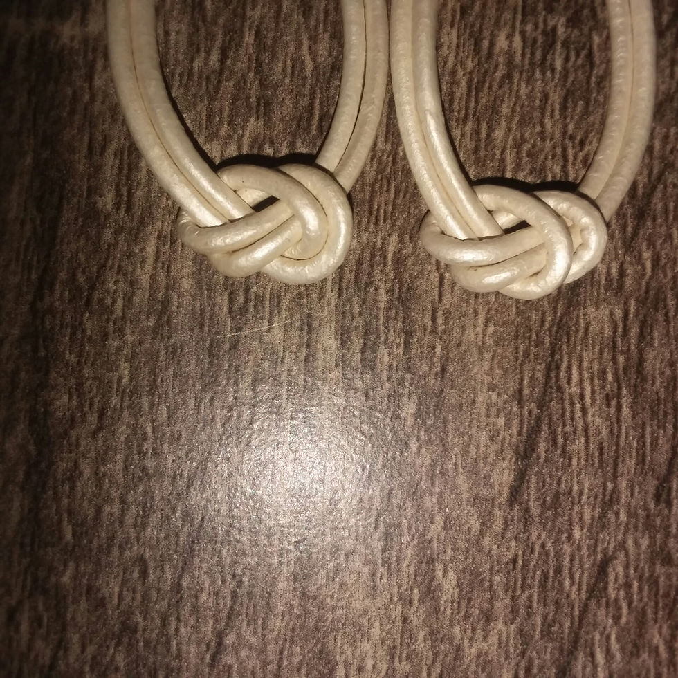 Thumbnail: Pearlized white Leather Cord Hoop earrings. 