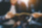 Christian couple or group reading study the bible together and pray at a home or Sunday sc