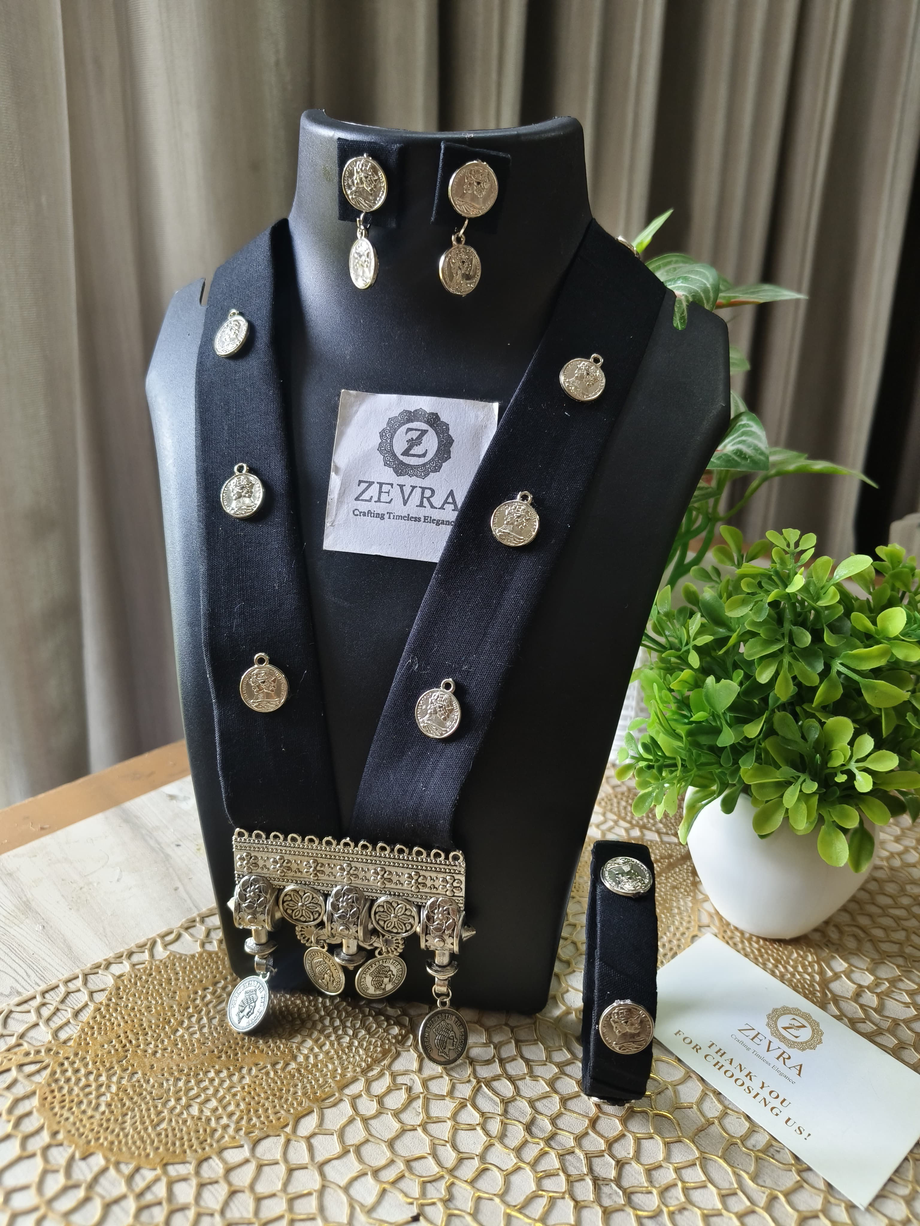Black pendant set with earrings and bangle