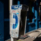 Classic picture of an old Bell payphone, long-since inoperable and covered in graffiti