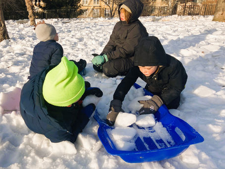 Filling a sled with snow