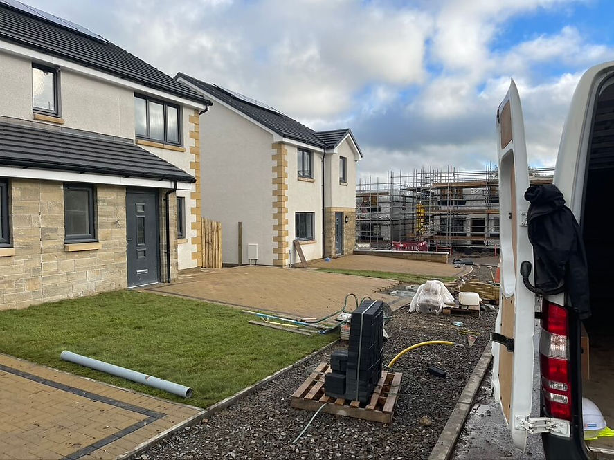 Row of new builds with construction work carrying on alongside