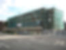 Large commercial building surrounded by scaffolding