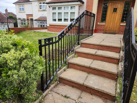 Black railing either side of path