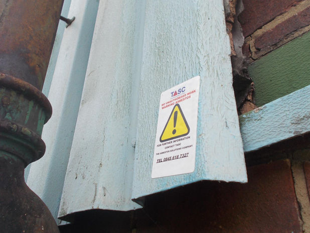Material marked with asbestos warning sticker