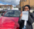 Lady covering face with one hand while holding up test certificate