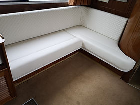 White upholstered seating in boat