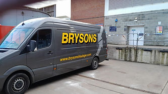 Brysons Haulage van parked by warehouse