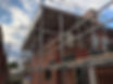 Residential house with scaffolding erected for roofing and renovation work