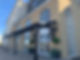 Steel canopy in front of lavish building
