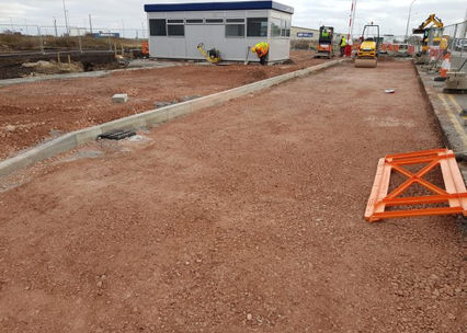 Construction site showing building and prepared site