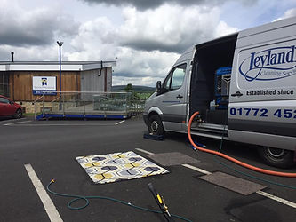 Rug placed outside van and ready to be cleaned