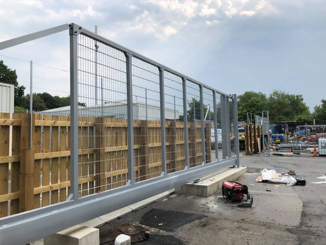 Metal fence being raised
