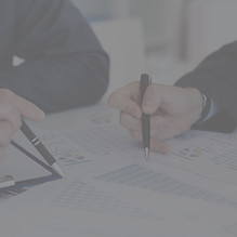 Two people analyzing data together