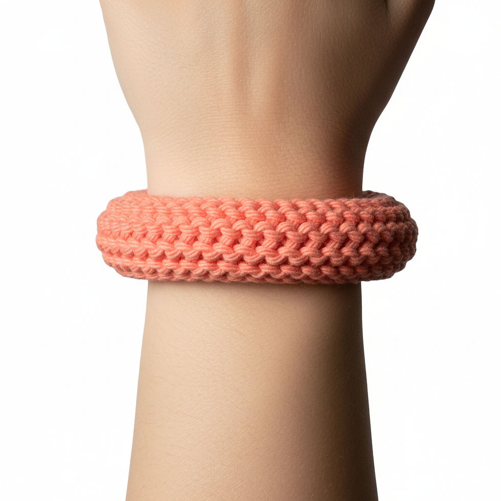 Thumbnail: Handcrafted crochet peach colored bangle, a custom crochet accessory by Creative Hooks.