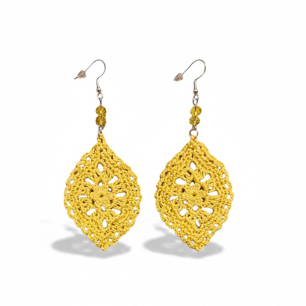 Handcrafted yellow crocheted leaf earrings with delicate bead accents on a white background.