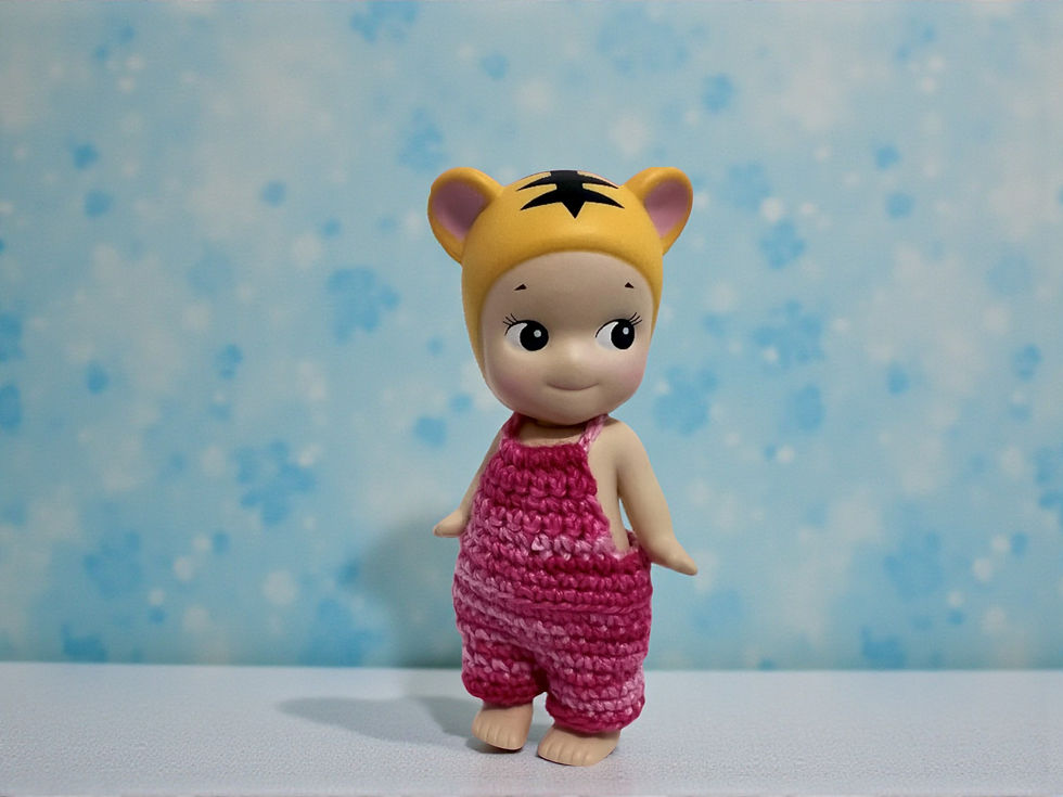Thumbnail: Handcrafted crochet jumper for Sonny Angel, pink and red variegated top and bottom.