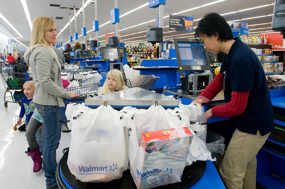 Walmart check-out aisle filled with paper bags
