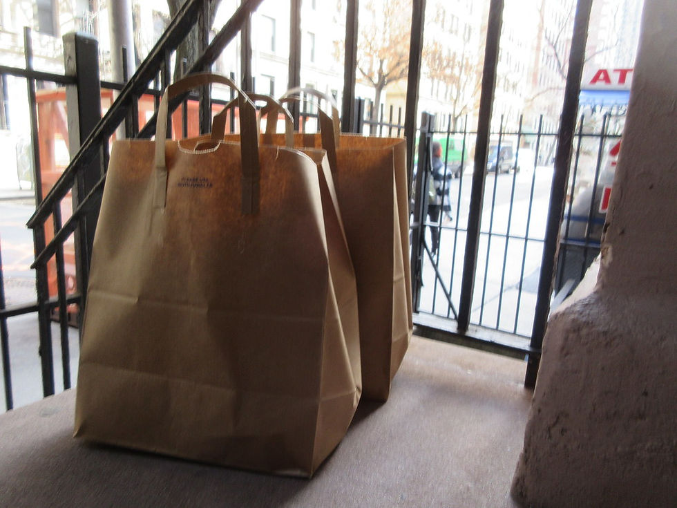 Paper bags sitting on a porch