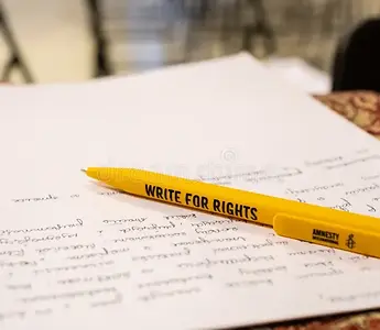 A piece of writing paper and a pencil labeled, "Write for Rights"