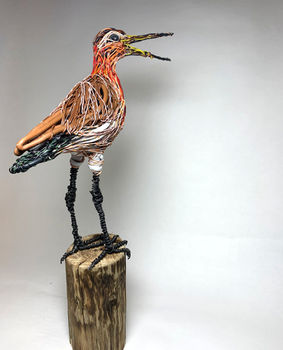 Sculpture of a calling wader perched on a fence post by Amanda Bradbury
