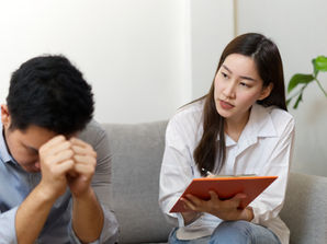 massage therapist communicating with client