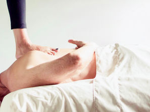 Experienced massage therapist practicing Ashiatsu barefoot massage