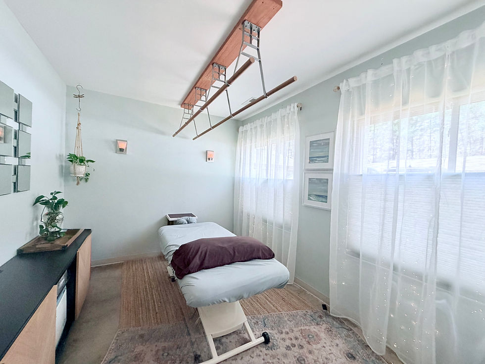 Massage therapy treatment room with natural light and windows designed to support client engagement
