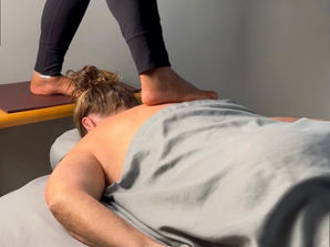 woman receiving barefoot massage