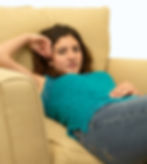 a girl slouching in a chair