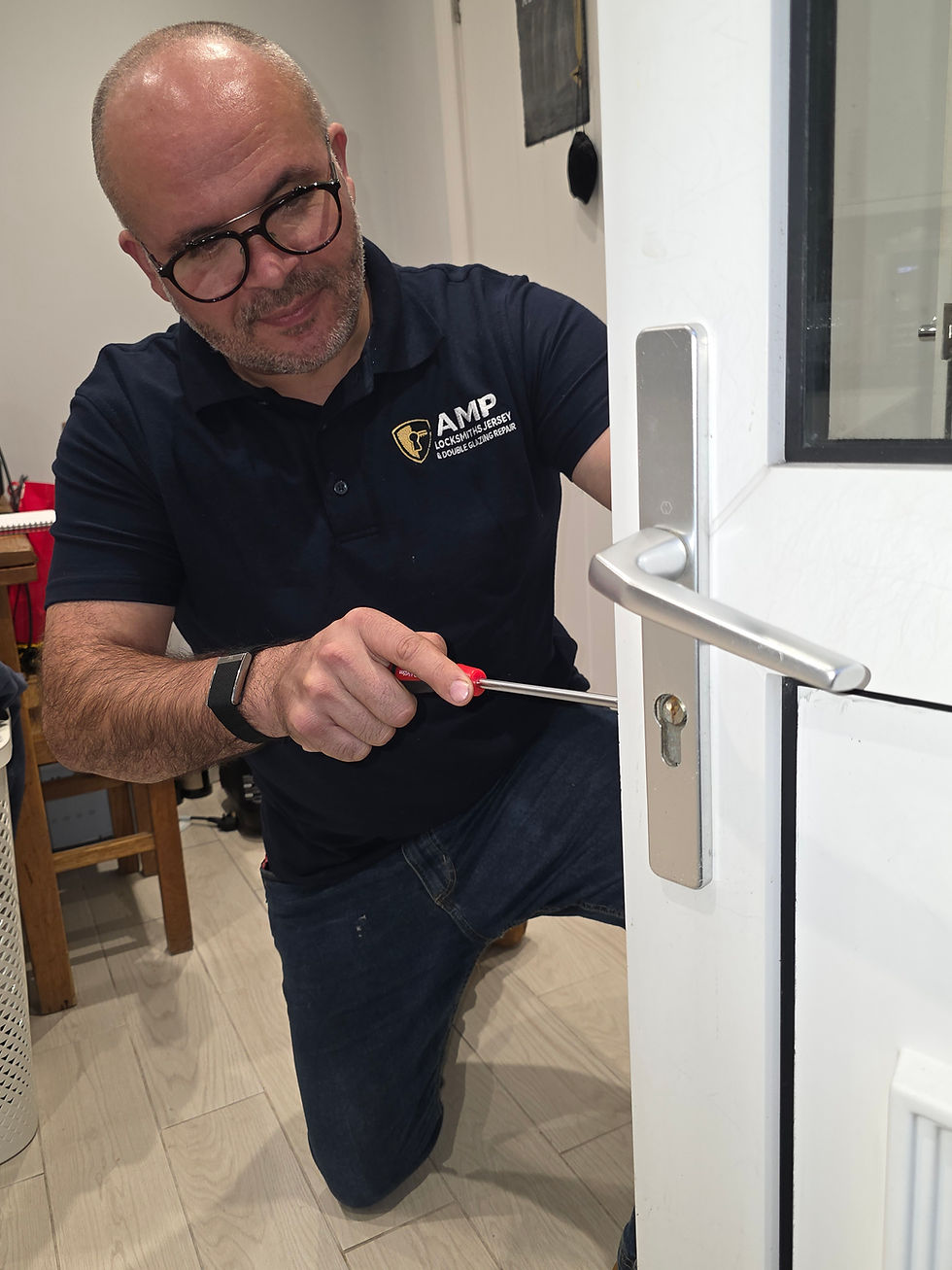 Close-up view of a locksmith installing a modern door lock