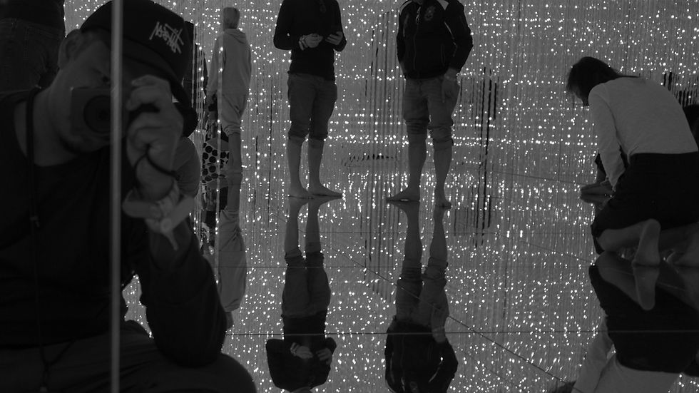 Couple reflected in mirrors during a documentary pre-wedding photography session