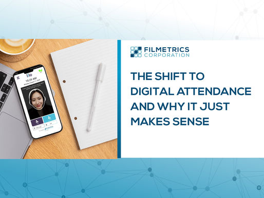 Smartphone displaying lilo digital attendance app beside a laptop and notebook, with text “The Shift to Digital Attendance and Why It Just Makes Sense”