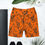 Thumbnail: Front view of a high-waist orange yoga shorts with black flowers