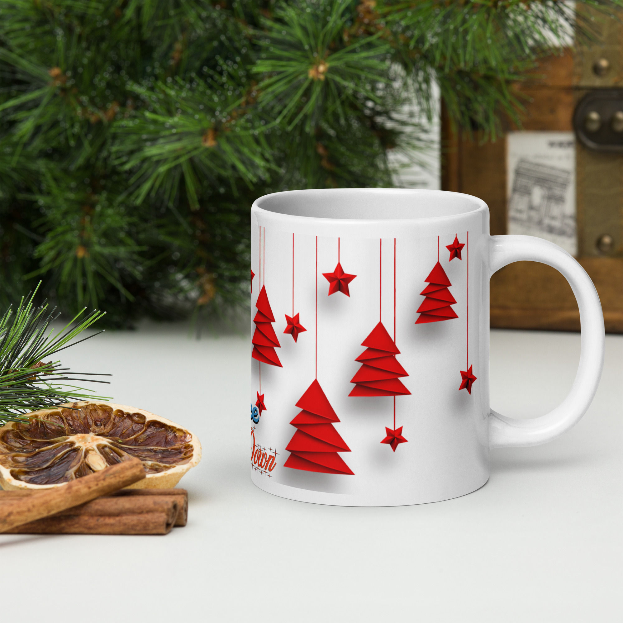 Left-side view of white Christmas mug with red Christmas trees an inscription